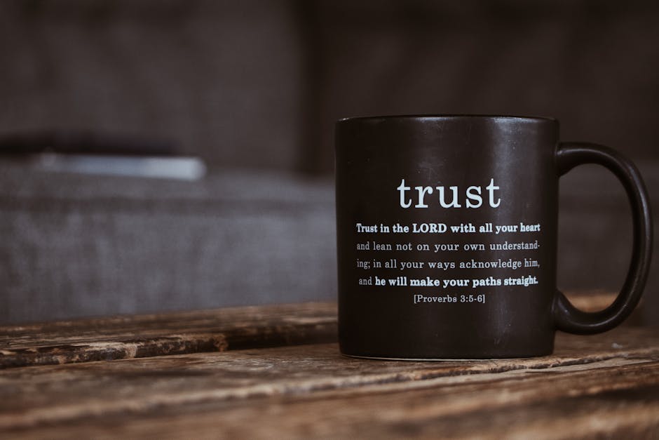 Black mug with the word Trust and biblical verse emphasizing integrity